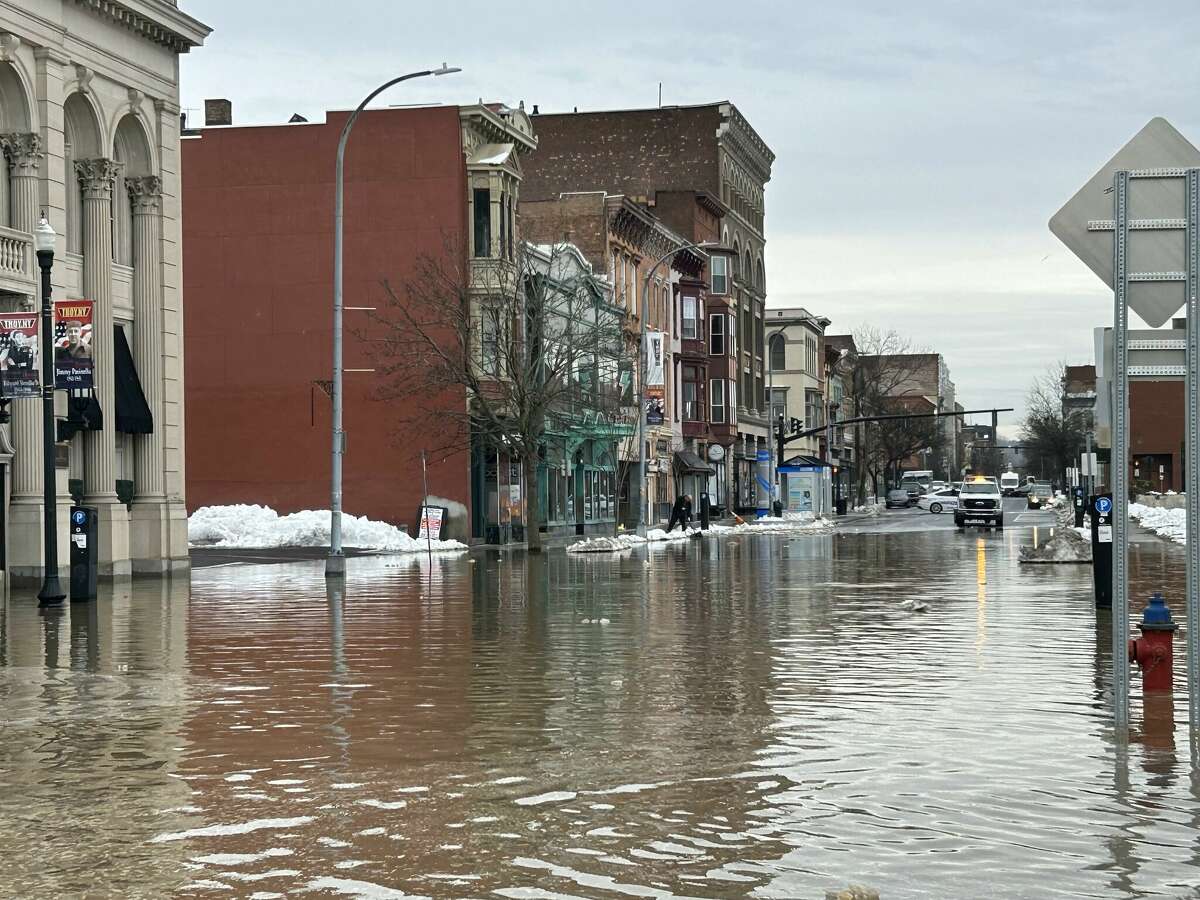 Water has flooded streets in Troy around 4th and Federal streets Friday, March 17, 2023 after a water main break.