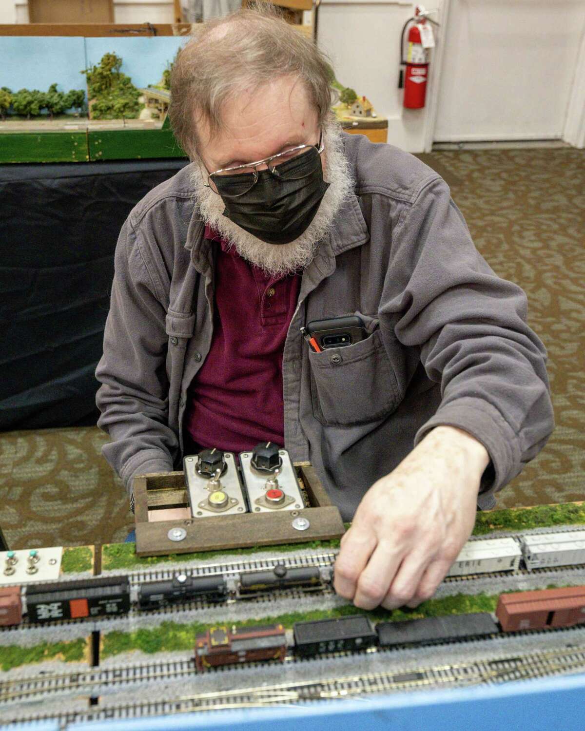 Rich Mesching sets up model trains at the Albany Train Show on Saturday, March 18, 2023, at the Polish Community Center in Albany, NY.