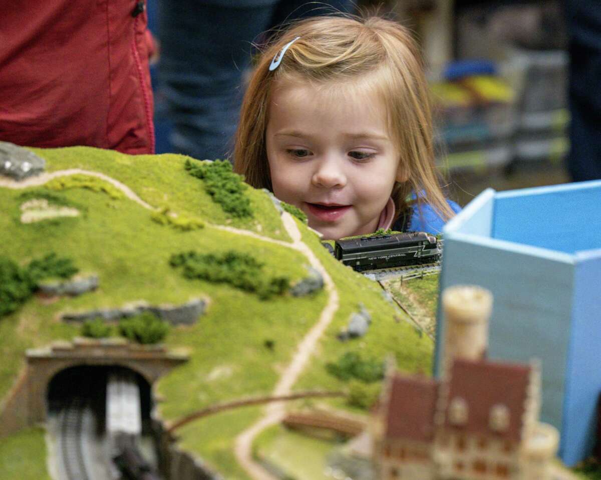 Vida Hacker watches a model train come through a tunnel Albany Train Show on Saturday, March 18, 2023, at the Polish Community Center in Albany, NY.