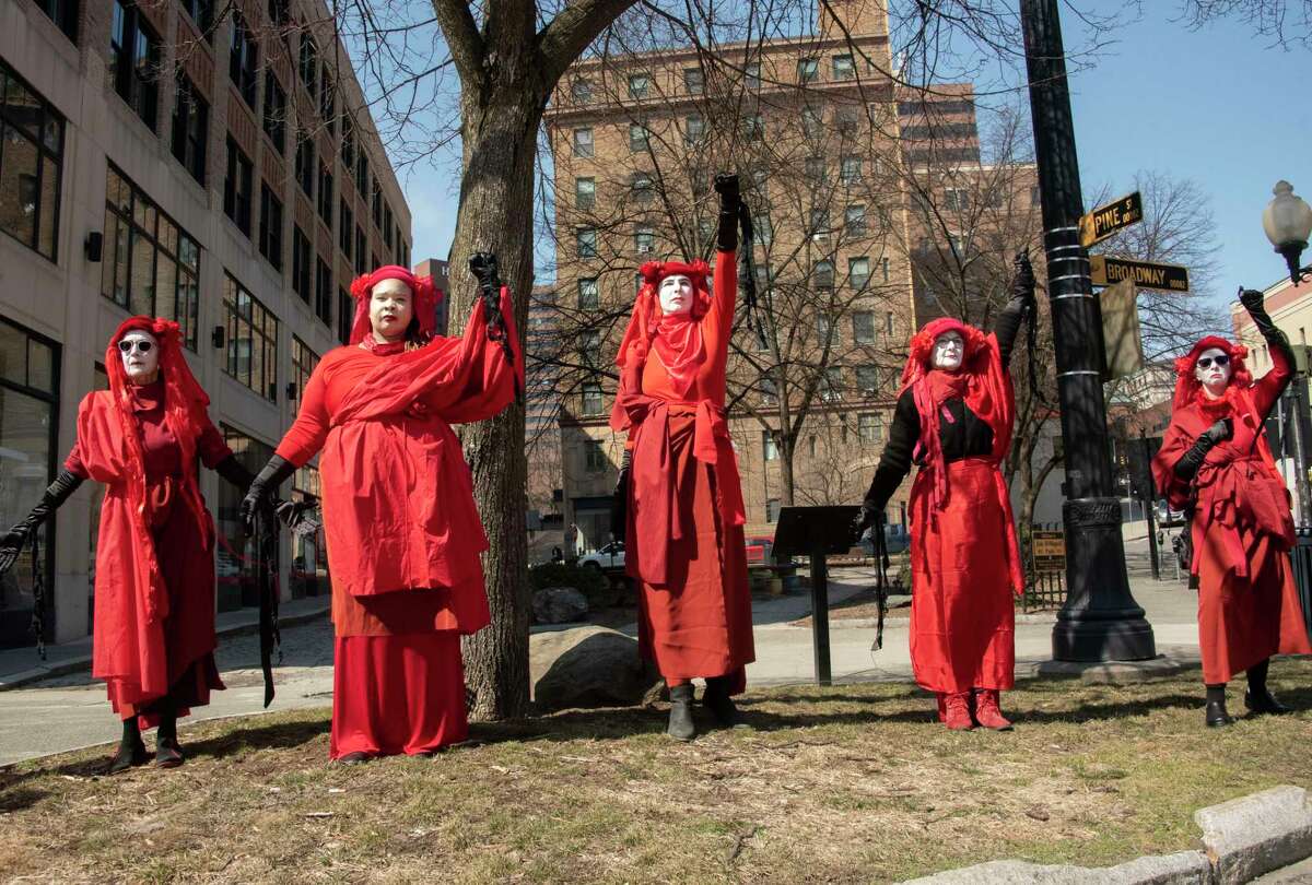 People participate in a climate march downtown to protest banks financing the fossil fuel industry on Tuesday, March 21, 2023 in Albany, N.Y.