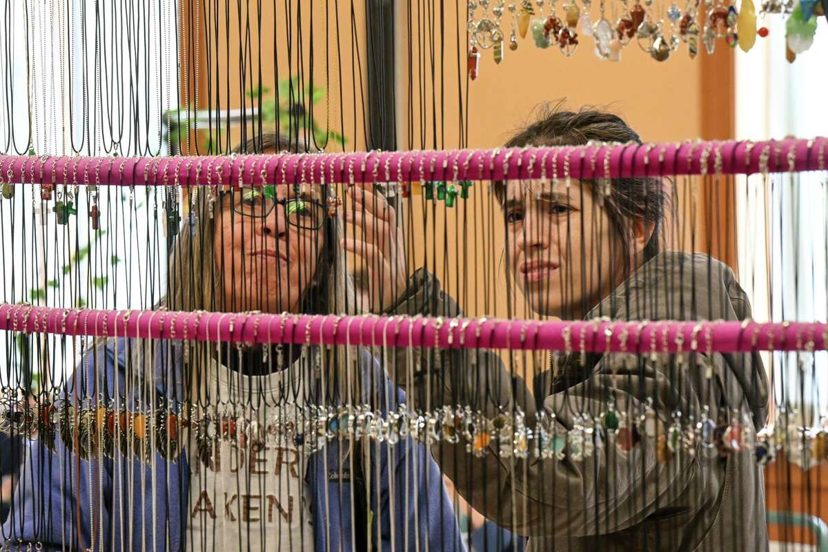 Dawna Leon, left, and Brandy Leon peruse necklaces during a village-wide craft and vendor fair on Saturday, April 1, 2023, in Altamont, NY.