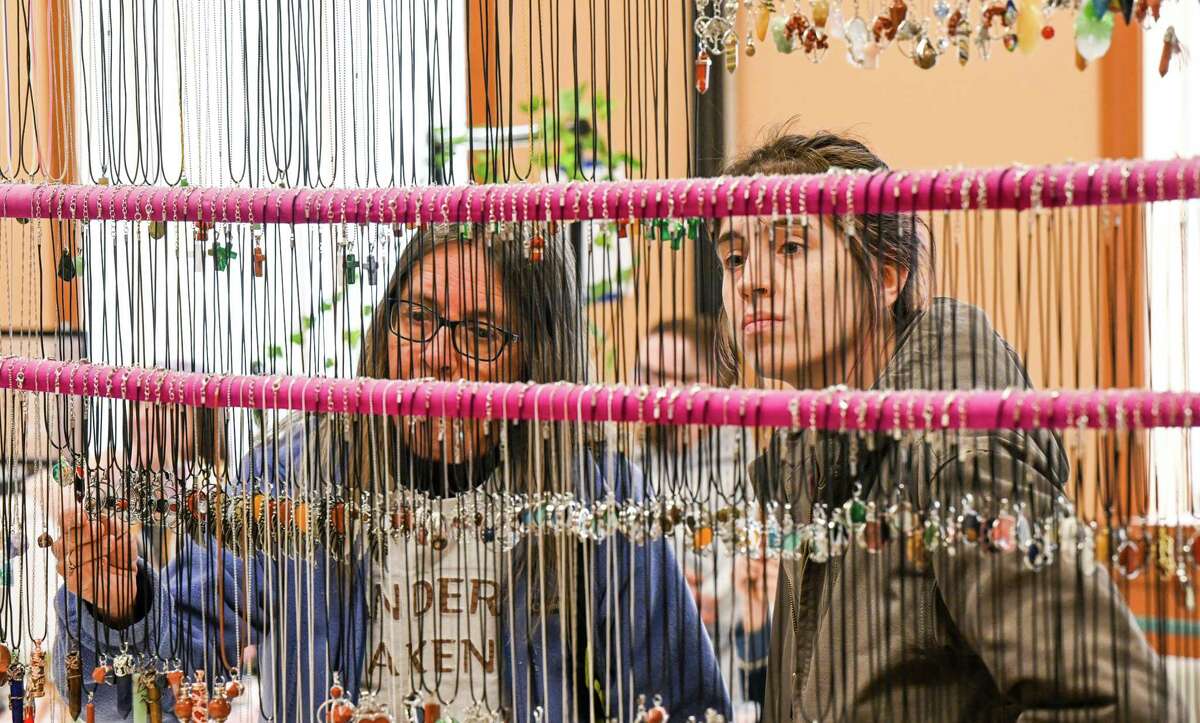 Dawna Leon, left, and Brandy Leon peruse necklaces during a village-wide craft and vendor fair on Saturday, April 1, 2023, in Altamont, NY.