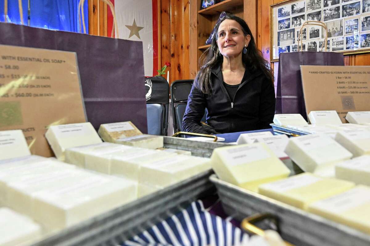 Carolyn Maccaro Russell sells soap during a village-wide craft and vendor fair on Saturday, April 1, 2023, in Altamont, NY.