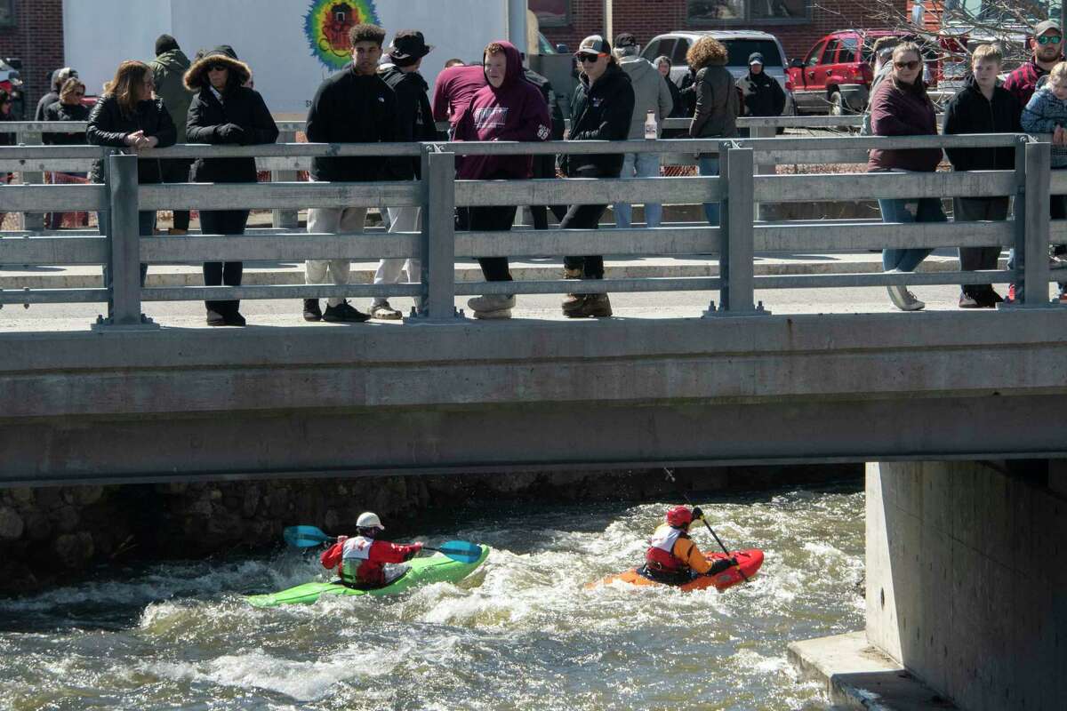 Spectators watch kayakers compete in the 48th Annual Tenandeho White-Water Derby on the Anthony Kill on Sunday April 2, 2023 in Mechanicville, N.Y.