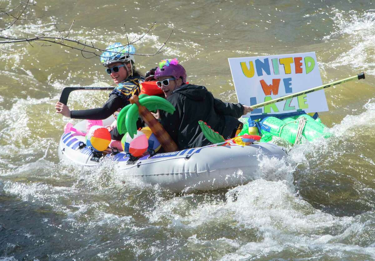 People are seen participating in the Anything That Floats Regatta in the 48th Annual Tenandeho White-Water Derby on the Anthony Kill on Sunday April 2, 2023 in Mechanicville, N.Y.