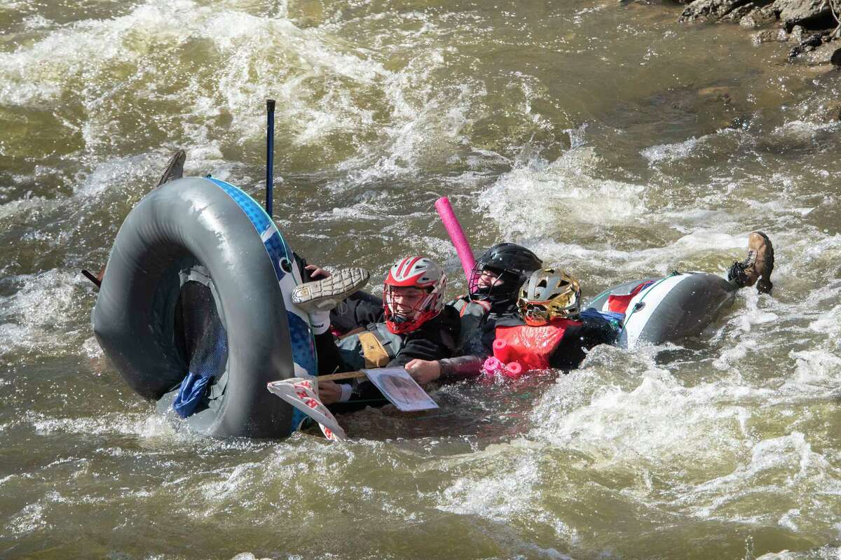 A float carrying participants starts to fall apart in the Anything That Floats Regatta in the 48th Annual Tenandeho White-Water Derby on the Anthony Kill on Sunday April 2, 2023 in Mechanicville, N.Y.