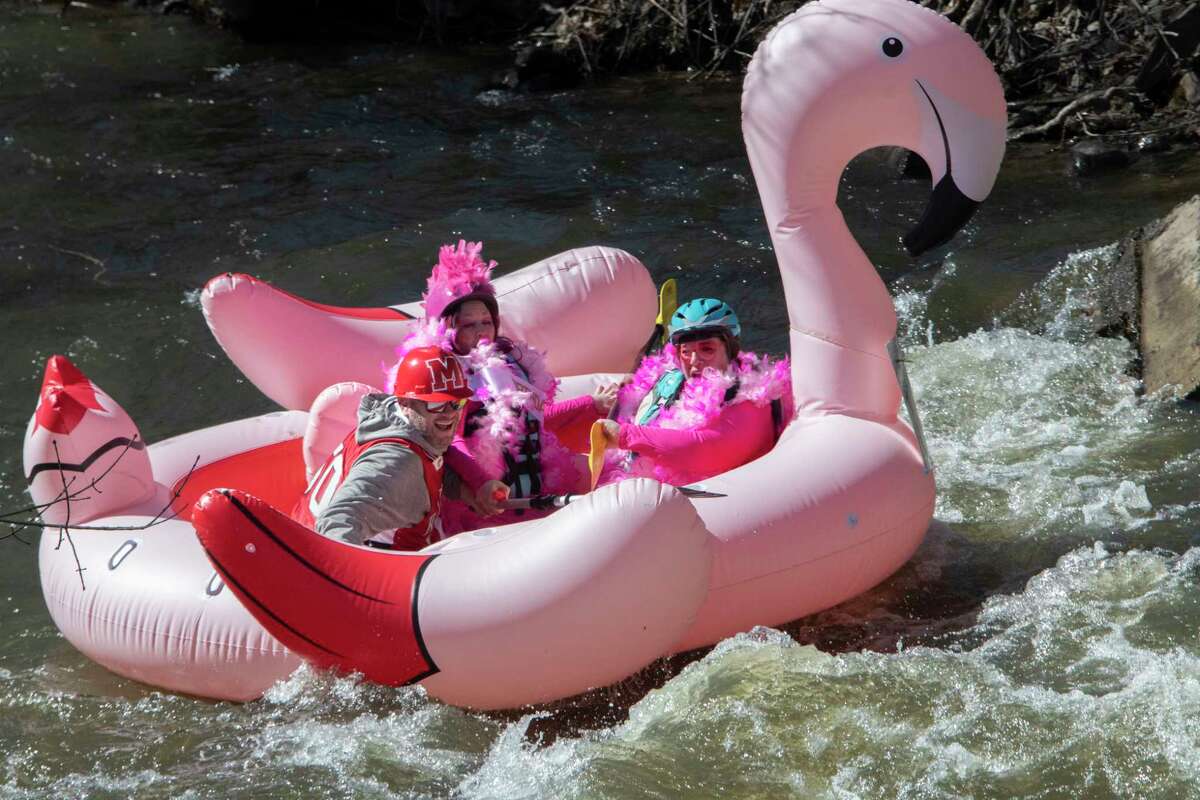 People are seen participating in the Anything That Floats Regatta in the 48th Annual Tenandeho White-Water Derby on the Anthony Kill on Sunday April 2, 2023 in Mechanicville, N.Y.