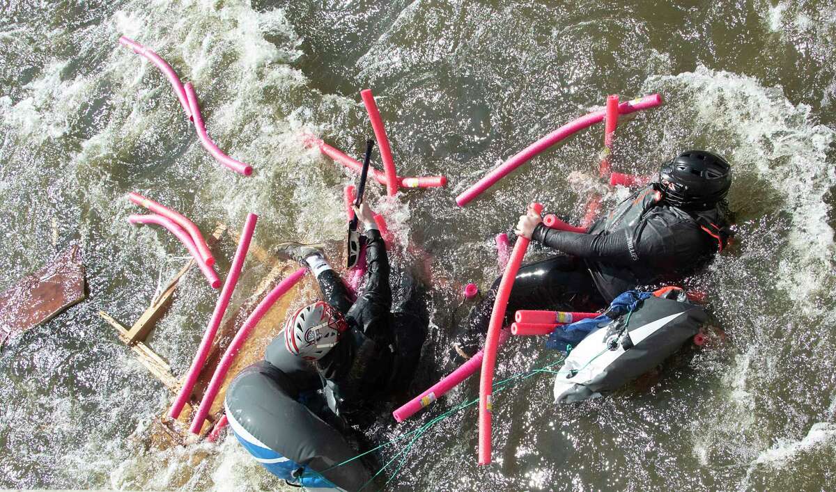 A float carrying participants falls apart in the Anything That Floats Regatta in the 48th Annual Tenandeho White-Water Derby on the Anthony Kill on Sunday April 2, 2023 in Mechanicville, N.Y.