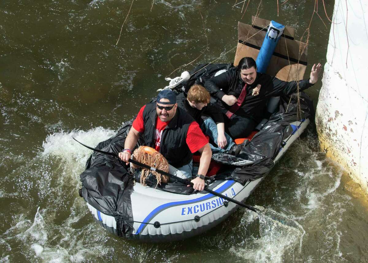 An Addams Family themed float carrying participants is seen in the Anything That Floats Regatta in the 48th Annual Tenandeho White-Water Derby on the Anthony Kill on Sunday April 2, 2023 in Mechanicville, N.Y.