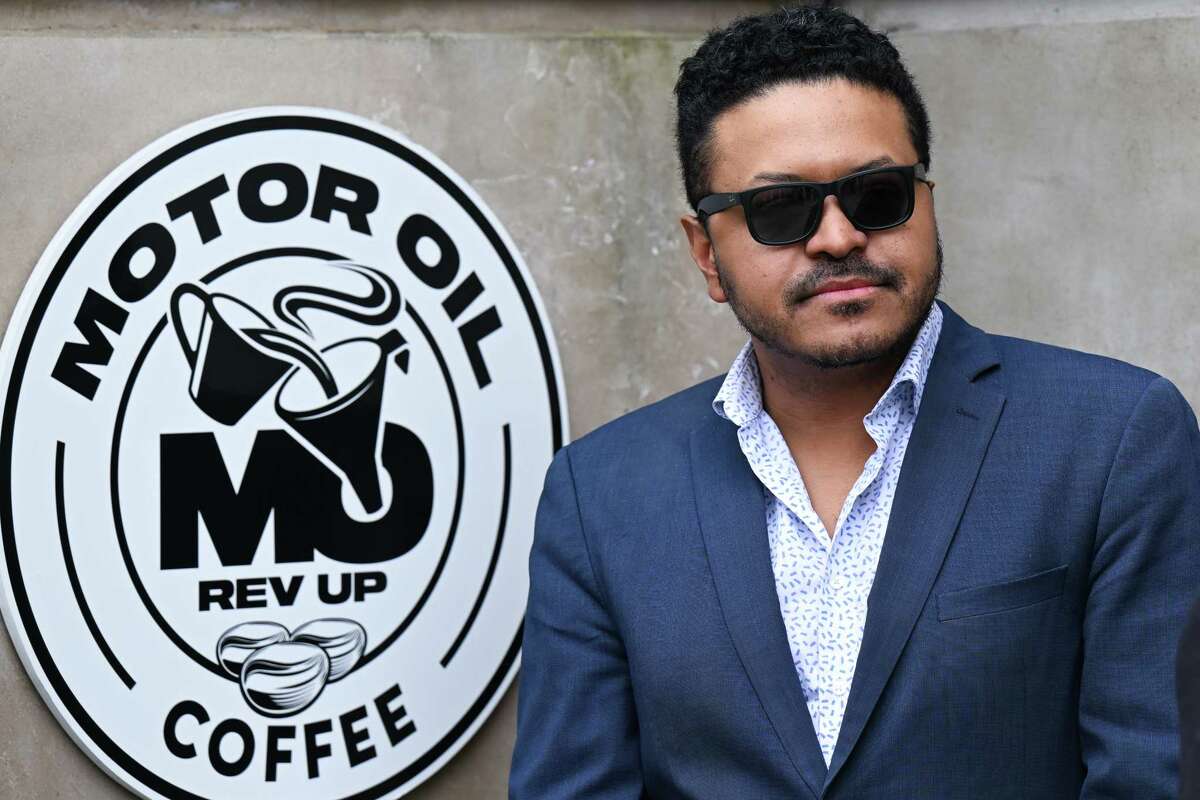 Joe Bonilla, co-founder of Motor Oil Coffee, at a ribbon cutting on Wednesday, April 5, 2023, for a new shop on State Street in Albany, NY.