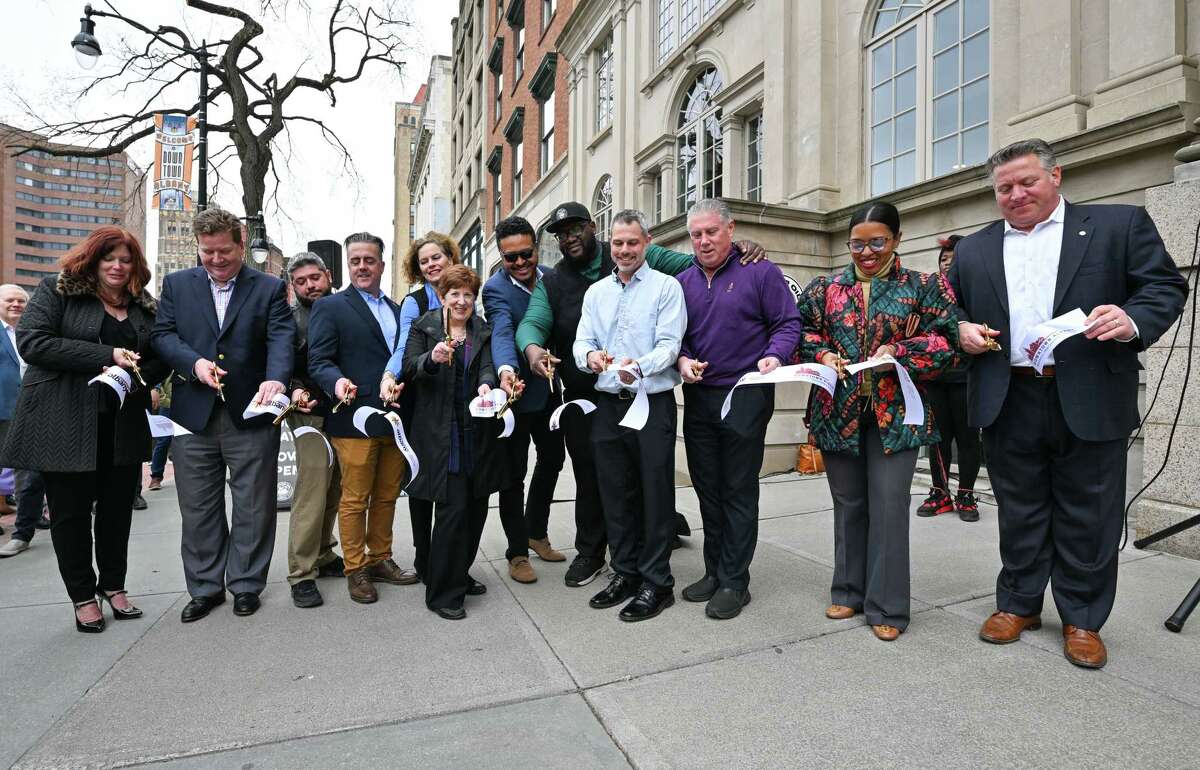 The ribbon is cut on Wednesday, April 5, 2023, for a new Motor Oil Coffee shop on State Street in Albany, NY.