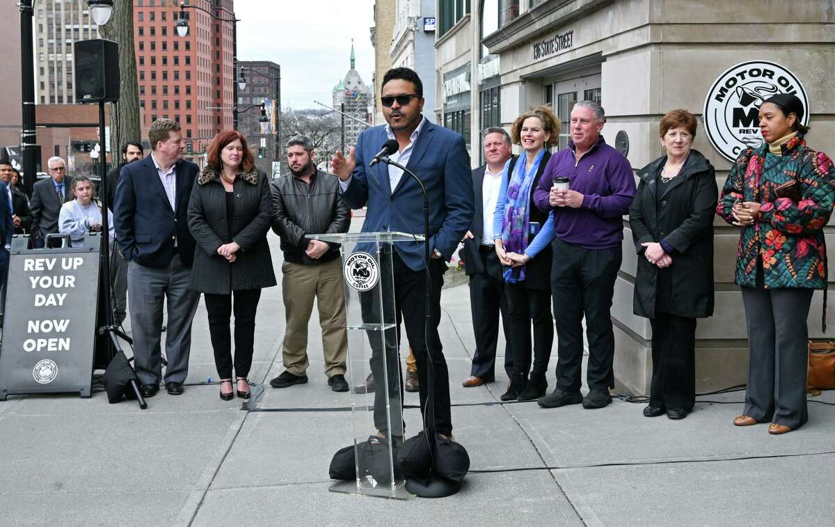 Joe Bonilla, co-founder of Motor Oil Coffee, speaks at a ribbon cutting on Wednesday, April 5, 2023, for a new shop on State Street in Albany, NY.