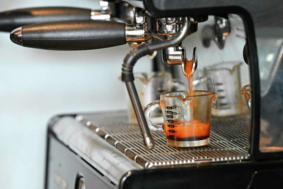 A cup of Motor Oil Coffee following a ribbon cutting on Wednesday, April 5, 2023, at a new shop on State Street in Albany, NY.