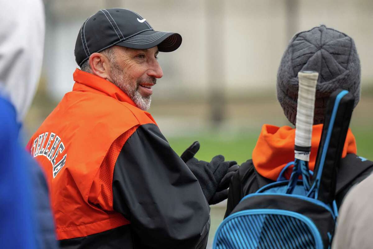 Bethlehem varsity boys tennis coach Steve Smith talks to one of his players during a match against CBA on Wednesday, April 19, 2023, at UAlbany in Albany, NY. The win gives Smith his 300th victory.