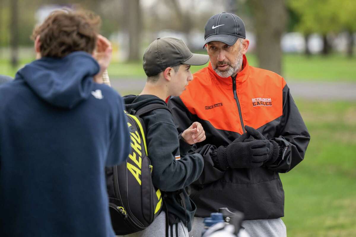 Bethlehem varsity boys tennis coach Steve Smith talks with Jacob Lyubarov during a match against CBA on Wednesday, April 19, 2023, at UAlbany in Albany, NY. The win gives Smith his 300th victory.