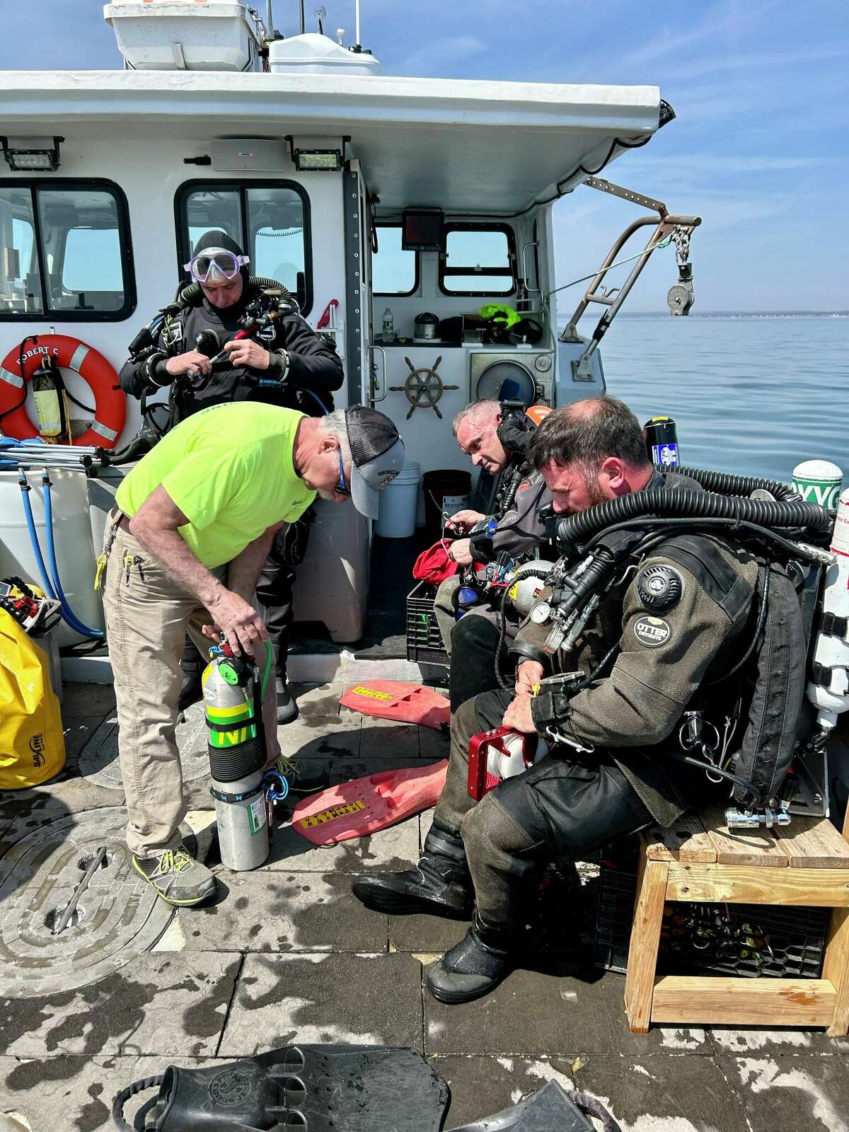 Crew members prepare to dive to the wreck believed to be the Defender, an experimental submarine built in the early 1900s and abandoned in the Long Island Sound.