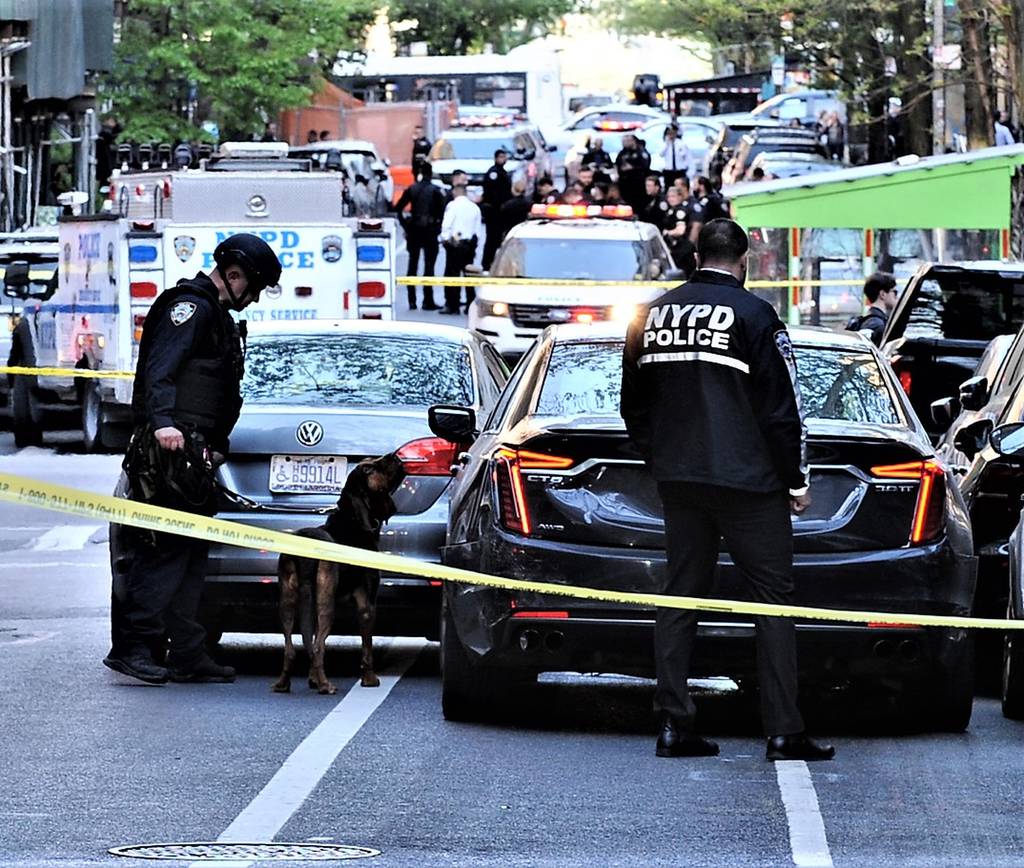 NYPD canine unit attempts to get a scent from the vehicle that struck a police officer and fled the scene on April 19, 2023.