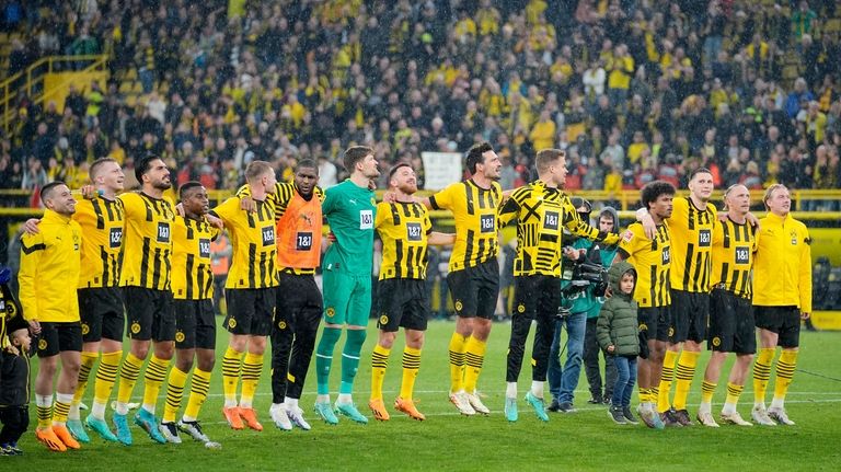 Dortmund' players celebrates after defeating Eintracht Frankfurt during the German...