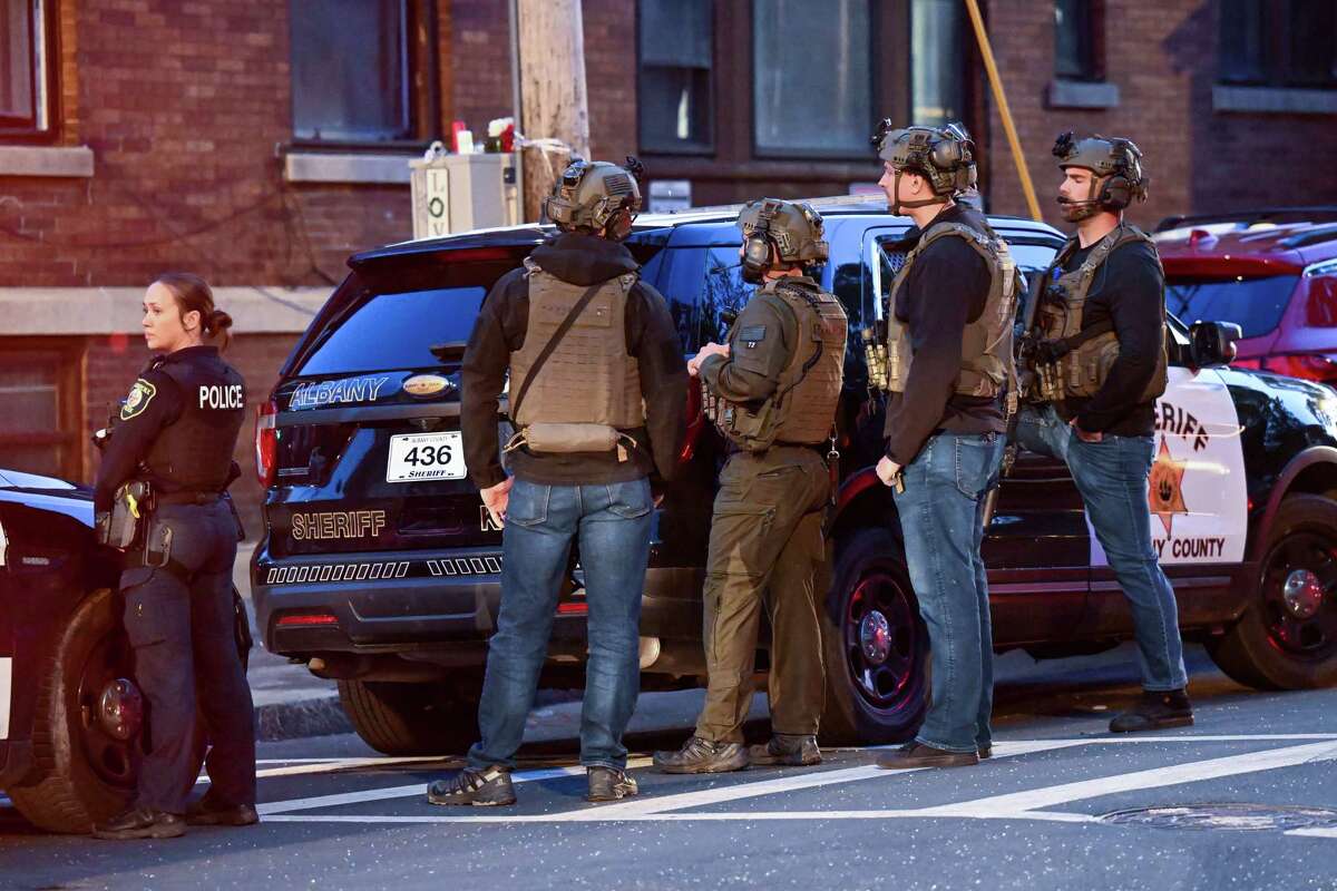 Police converge on a section of Lark Street Thursday night, April 27, 2023.