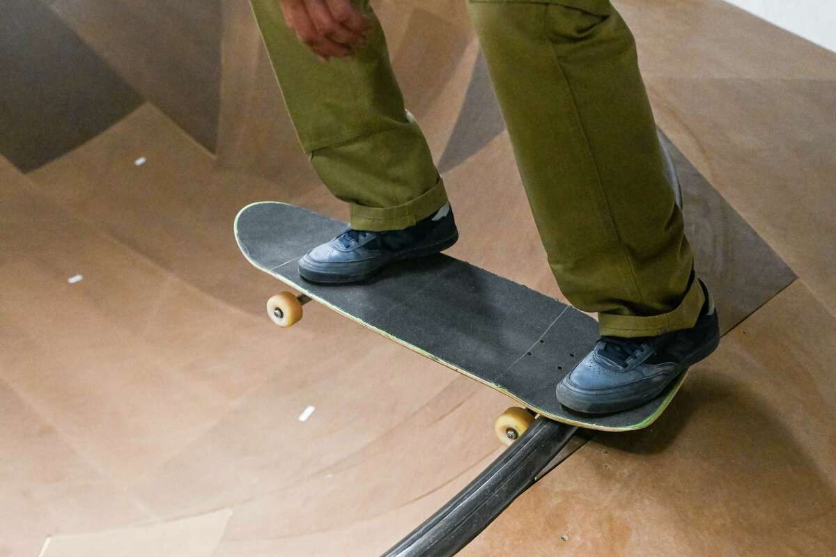 A skateboarder gets ready to skate into the bowl during the grand opening of the Noteworthy Community Center’s indoor skate park on Saturday, April 29, 2023, on Broadway in Albany.