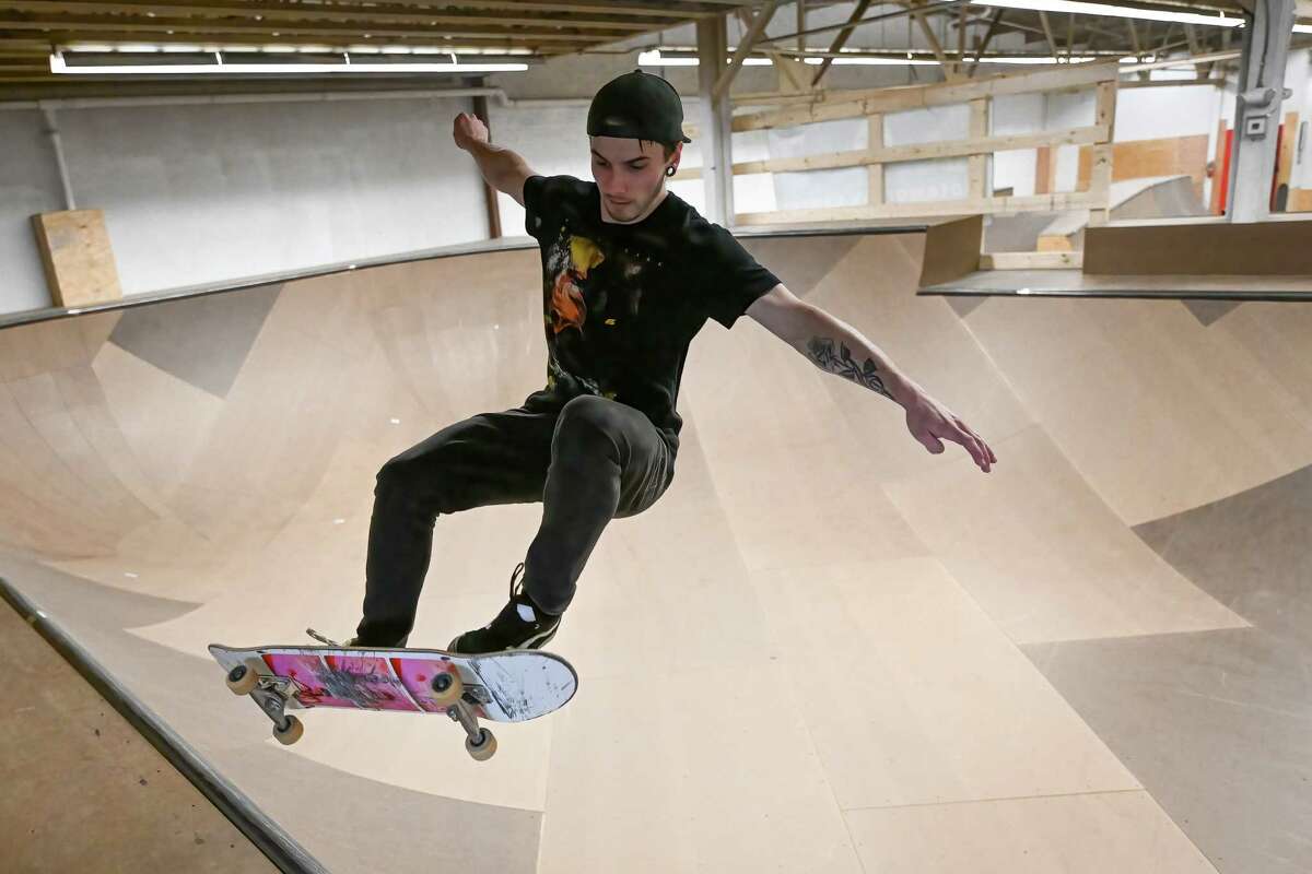 Noah Rose gets some air while skating in the bowl during the grand opening of the Noteworthy Community Center’s indoor skate park on Saturday, April 29, 2023, on Broadway in Albany.