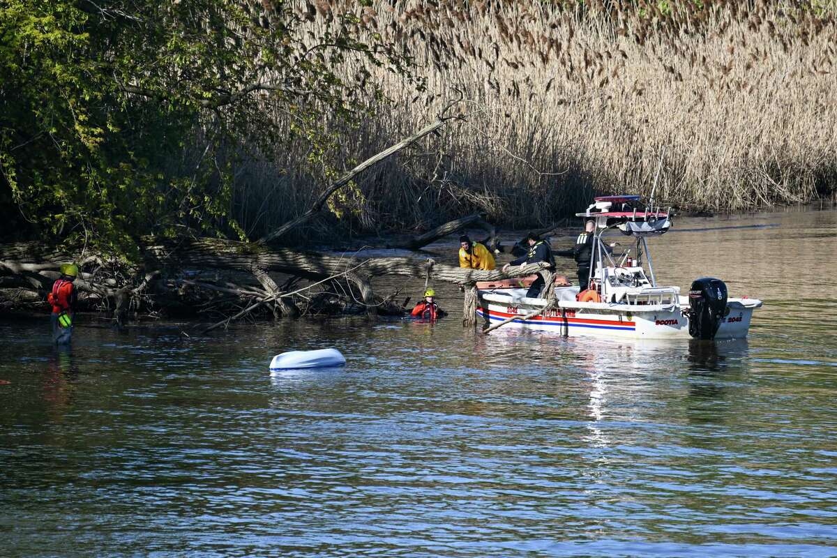 Members of the Scotia Fire Department rescue a would-be capsized kayaker during a multi-agency water rescue training exercise on Saturday, May 6, 2023, along the Mohawk River in Schenectady, NY.