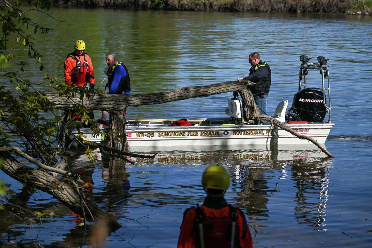 Members of the Schonowe Fire Department rescue a would-be capsized kayaker during a multi-agency water rescue training exercise on Saturday, May 6, 2023, along the Mohawk River in Schenectady, NY.