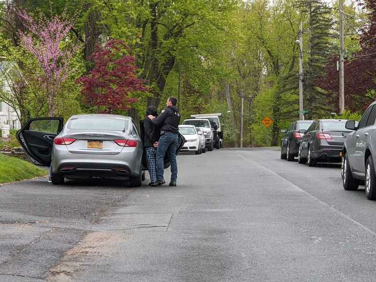 A person is taken into custody for questioning as State Police searched a home on Gardner Terrace in Bethlehem on Thursday.