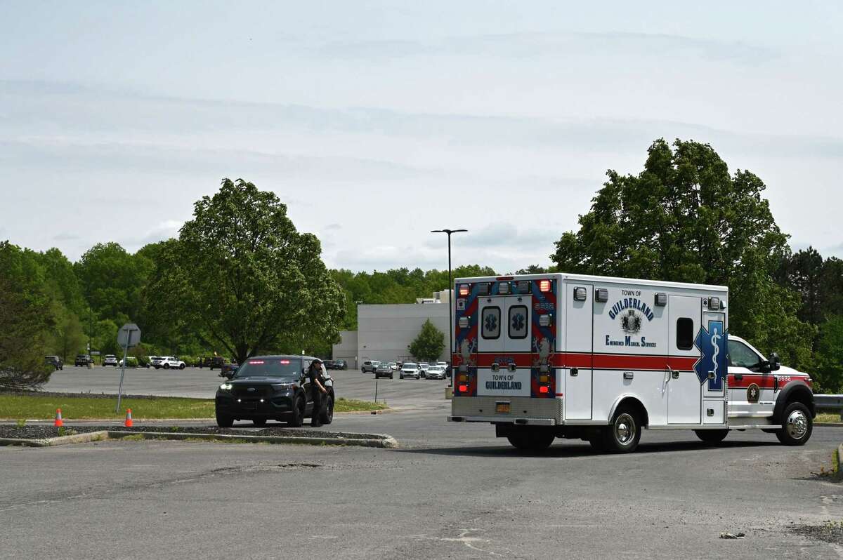 A Town of Guilderland ambulance leaves Crossgates Mall after police respond to reports of shots fired at the shopping center on Friday, May 19, 2023, in Guilderland, N.Y. An Albany teenager was later arrested for falsely reporting the shooting, police said. 