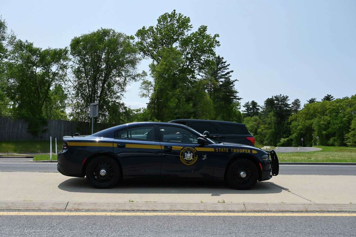 Police respond to reports of shots fired at Crossgates Mall on Friday, May 19, 2023, in Guilderland, N.Y. An Albany teenager was later arrested for falsely reporting the shooting, police said. 