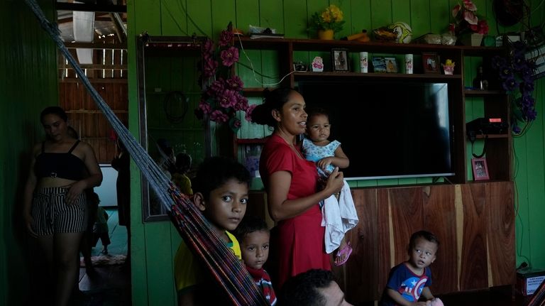 Fernanda de Araujo Moraes, center, president of the local riverine...