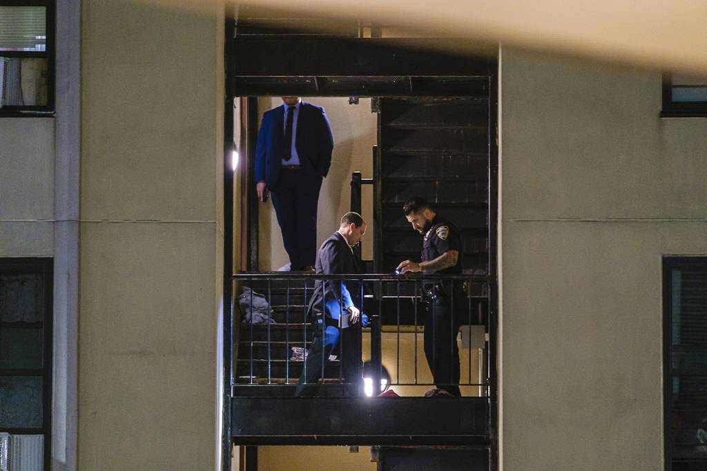 NYPD cops investigate the double shooting on Drew St. in East New York, Brooklyn, Saturday.