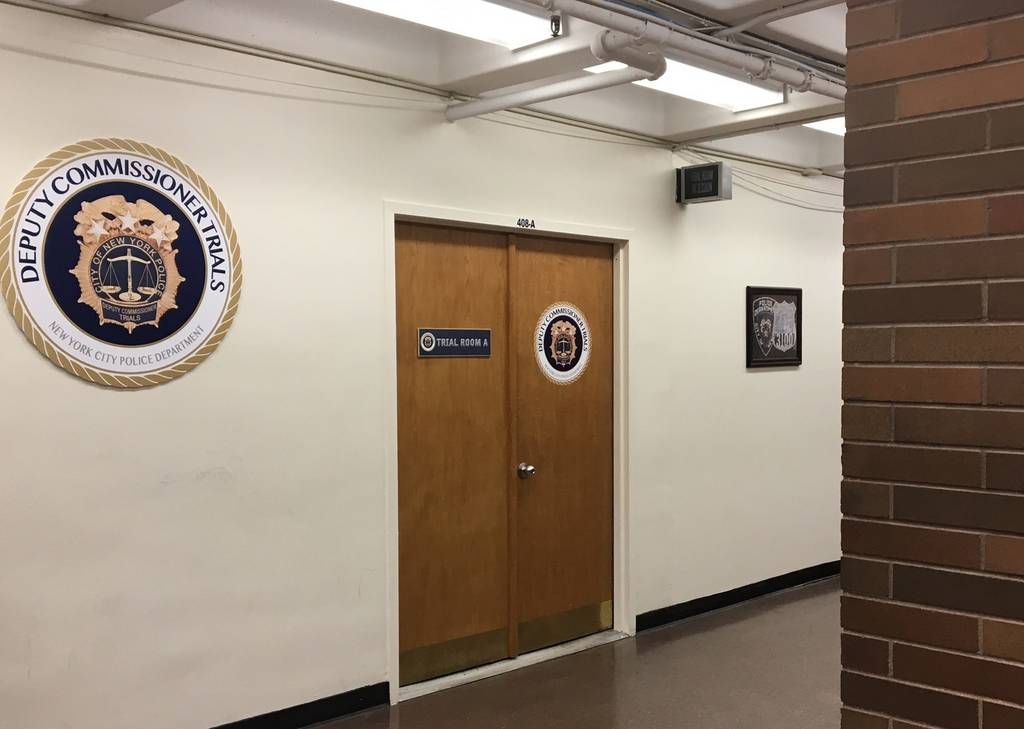 This Friday, Oct. 7, 2016 photo shows the doors to a courtroom where New York City police officers face administrative trials accusing them of misconduct ranging from disobeying orders to aggressive arrests resulting in a suspect's death.