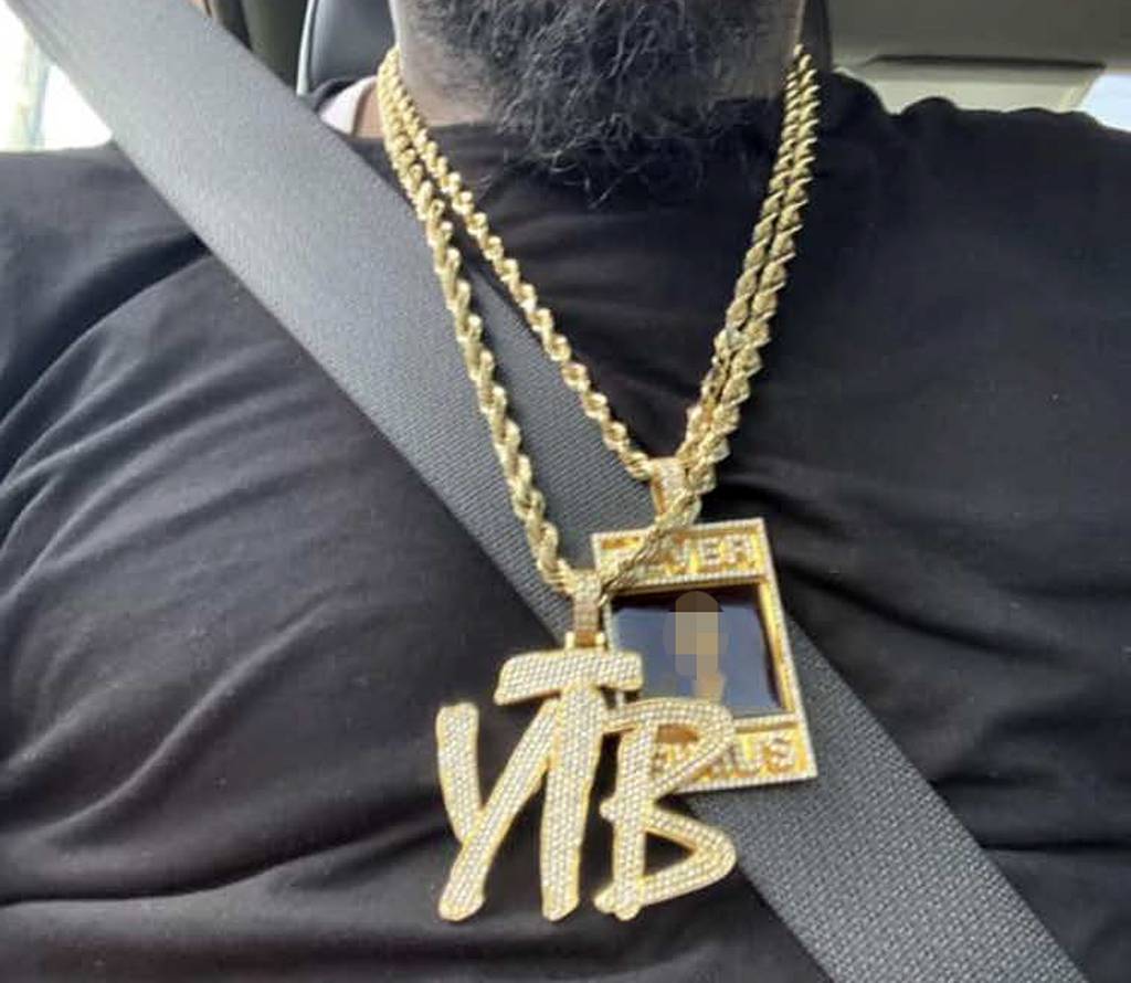 A popular drill rapper’s stolen gold chain (pictured here) led to a revenge murder in Queens, and now the leader of the musician’s street gang is facing a federal trial for pulling the trigger. YTB stands for “Yellow Tape Boyz.” 