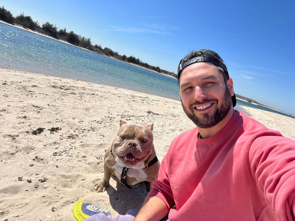 Molly the dog living her best life with her new owner Jared, 36.