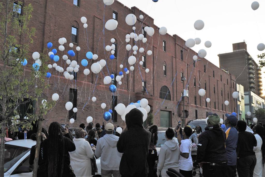 Scores of friends and family release tribute balloons at the vigil held Friday for Garrett Warren at General Charles Young Park on W. 143rd St. in Harlem.