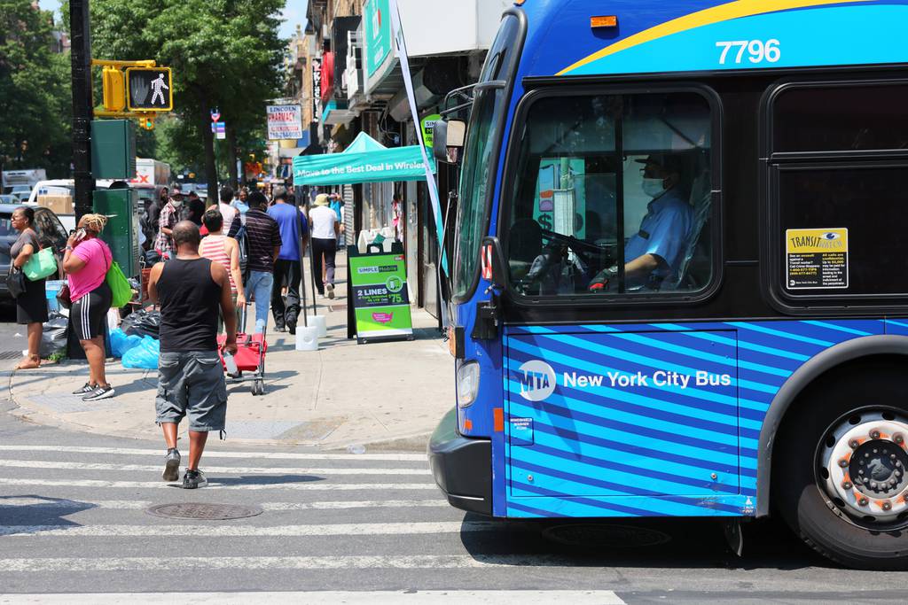 An MTA bus driver waits to turn into Flatbush Avenue on July 22, 2022, in the Flatbush neighborhood of Brooklyn in New York City. 