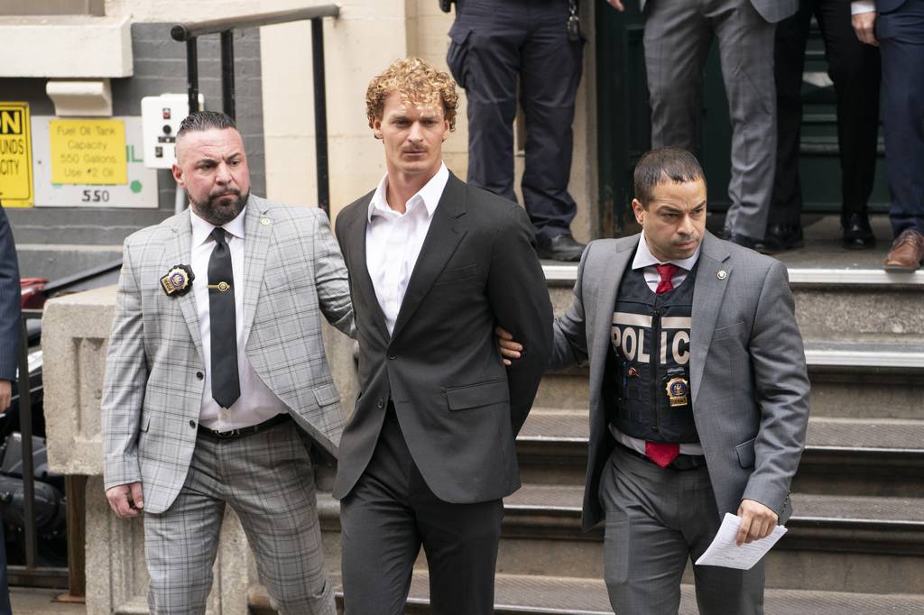 Daniel Penny is escorted from the NYPD 5th Precinct stationhouse on Friday, May 12, 2023, in Manhattan, New York. 