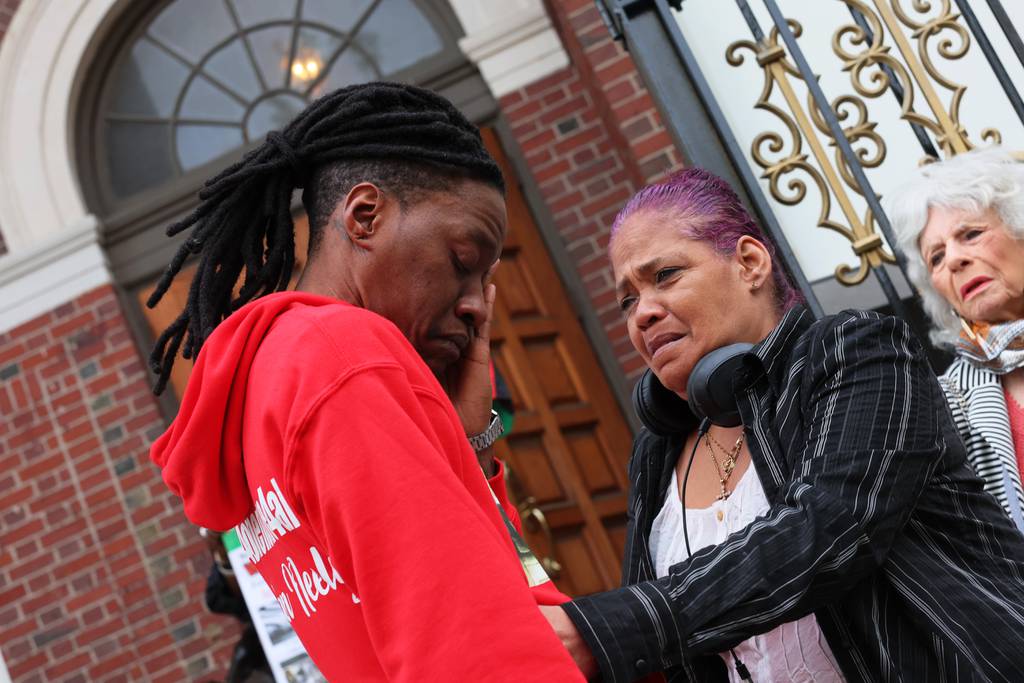 Larry Smith, Jordan Neely’s foster brother is consoled as he arrives for the public viewing and funeral service of Jordan Neely at Mount Neboh Baptist Church on May 19, 2023 in New York City. 