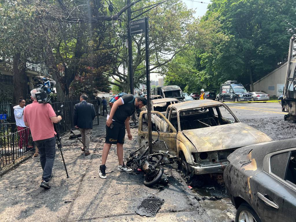 A box truck caught fire on a Bronx street early Wednesday, May 24, 2023, sparking a massive inferno that destroyed several nearby vehicles. 