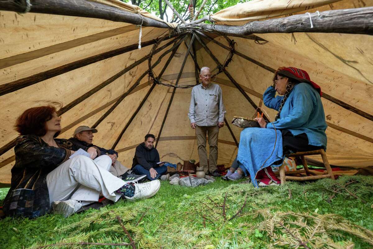 Jennifer Lee, right, talks about living in a teepee in the 18th century during Pinkster — which began as a Dutch holiday but became an African celebration of family, hope and cultural identity — on Saturday, June 3, 2023, at Schuyler Mansion in Albany, NY.