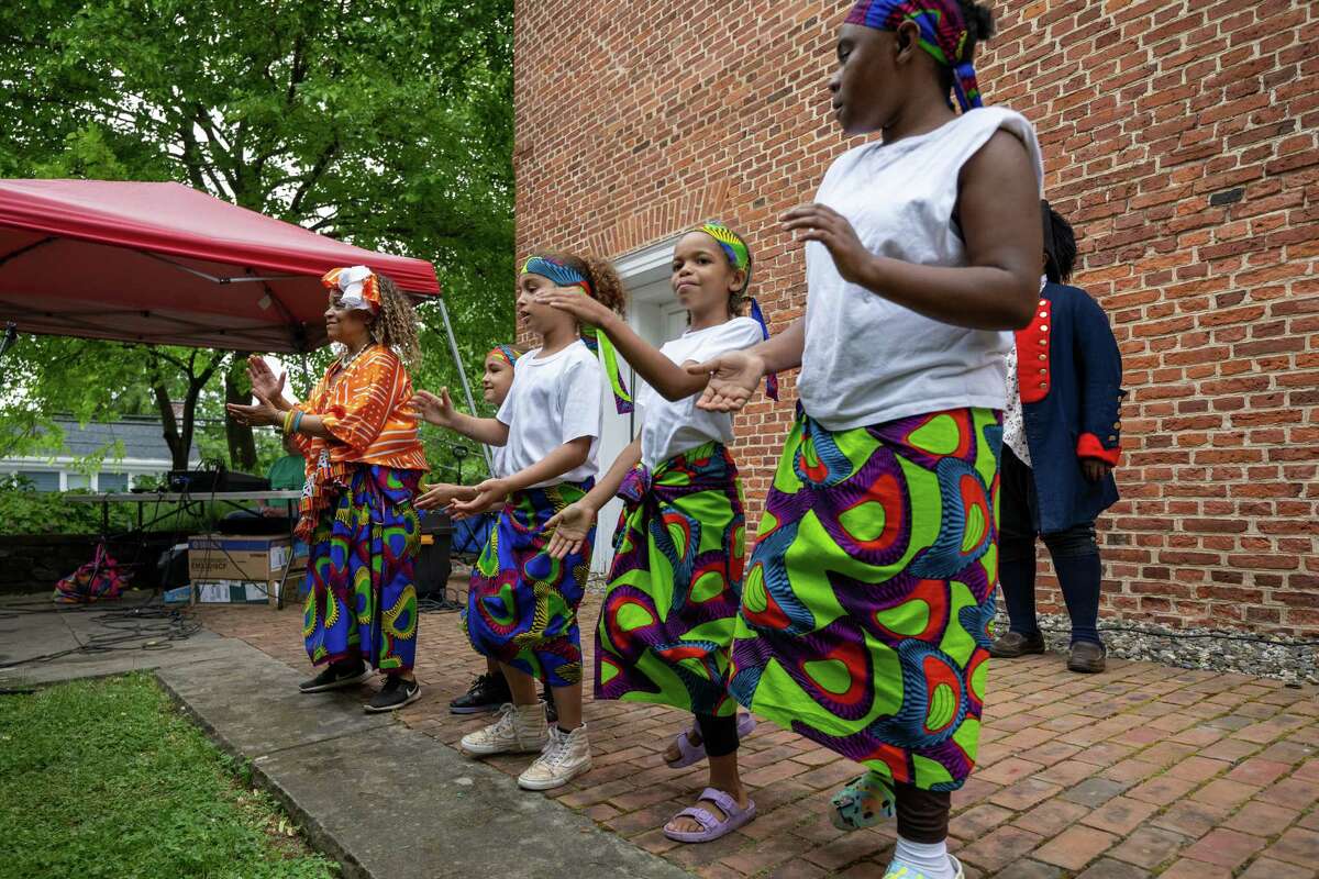 Operation Unite NY dances to music by Zorkie Nelson during Pinkster — which began as a Dutch holiday but became an African celebration of family, hope and cultural identity — on Saturday, June 3, 2023, at Schuyler Mansion in Albany, NY.