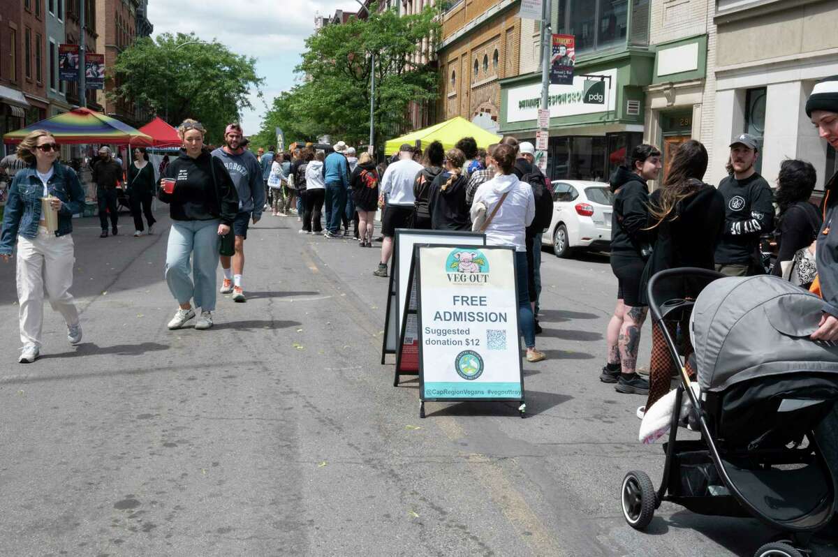 People wait in long lines for their favorite vegan food as the Capital Region Vegan Network holds their annual Veg Out event featuring vegan food from area restaurants on Sunday, June 4, 2023 in Troy, N.Y.