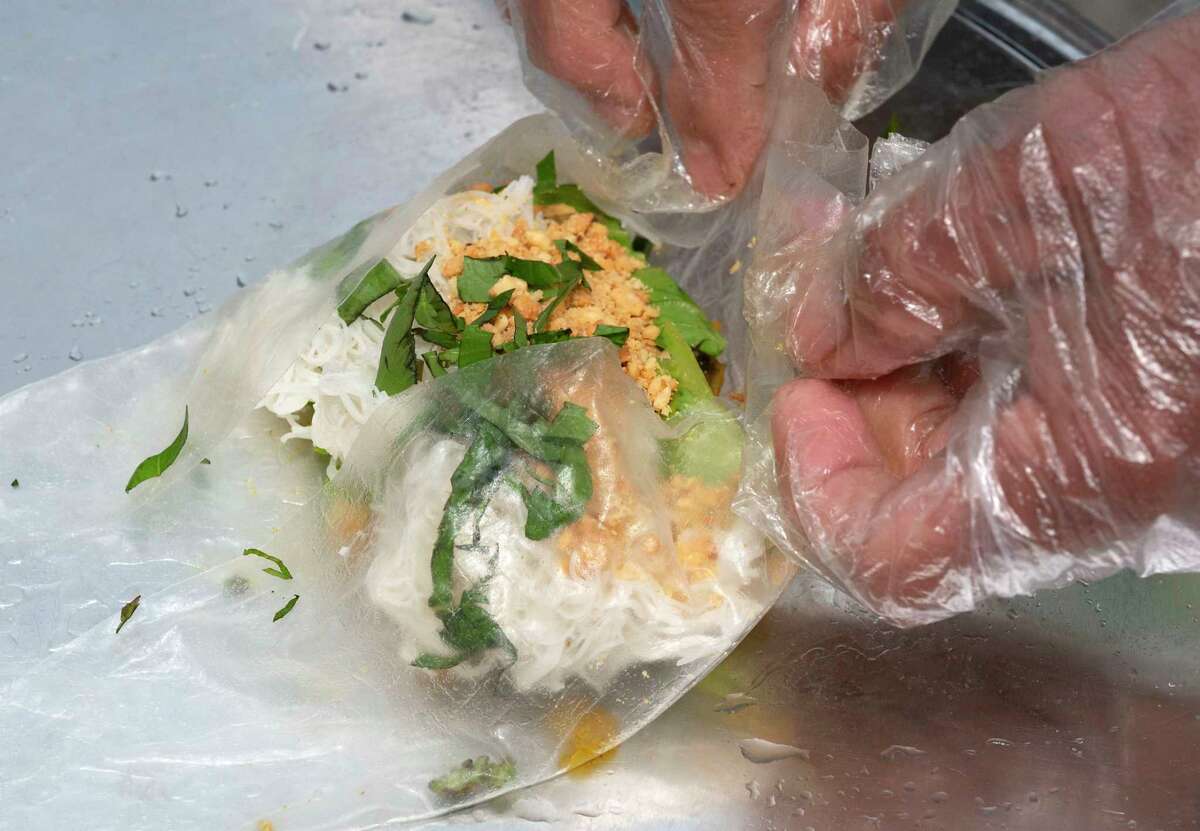 An Autumn roll with tofu is made at the Pho Yum booth as the Capital Region Vegan Network holds their annual Veg Out event featuring vegan food from area restaurants on Sunday, June 4, 2023 in Troy, N.Y.