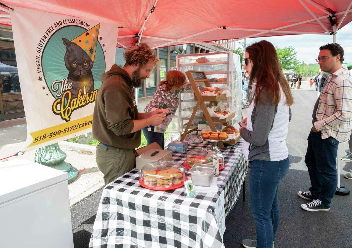 People purchase sweets at The Cakerio booth as the Capital Region Vegan Network holds their annual Veg Out event featuring vegan food from area restaurants on Sunday, June 4, 2023 in Troy, N.Y.