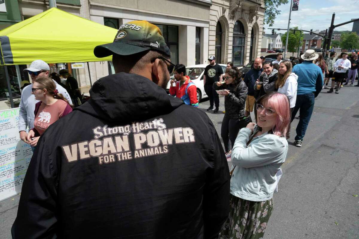 People wait in long lines for their favorite vegan food as the Capital Region Vegan Network holds their annual Veg Out event featuring vegan food from area restaurants on Sunday, June 4, 2023 in Troy, N.Y.