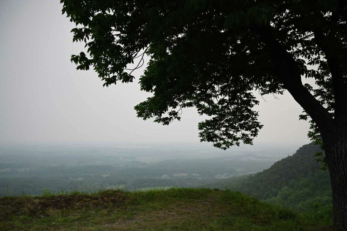 Thick smoke from Canadian wildfires clouds the view from John Boyd Thacher State Park on Tuesday, June 6, 2023, in New Scotland, N.Y. The region is under an air quality advisory as smoke moves down from the more than 100 active wildfires in burning Quebec.