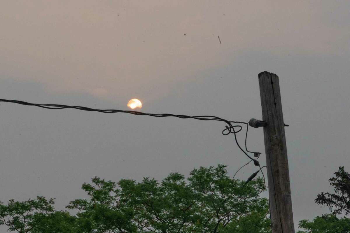 The morning sun rising in the east is muted by poor air quality caused by Canadian wildfires on Tuesday, June 6, 2023 in North Greenbush, N.Y.