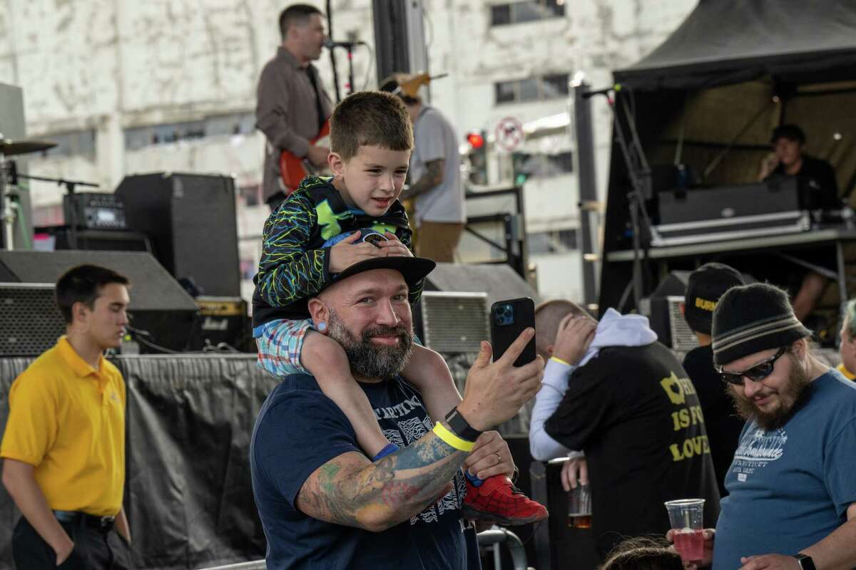 Josh Blair takes a selfie of he and his son Atlas, who was attending his first concert, the kickoff of the 2023 Alive at Five concert series featuring Bad Luck and Hawthorne Heights in the rain location under the Route 787 bridge on Thursday, June 8, 2023, in Albany, NY.