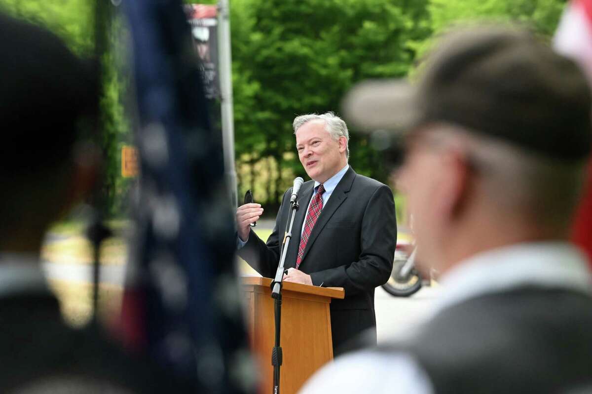 Guilderland Supervisor Peter Barber recognizes Guilderland town veterans during a ceremony to unveil eight new hometown heroes banners featuring local veterans on Friday during a ceremony at Tawasentha Park in Guilderland. The program honors local heroes who have served and continue to serve in the Armed Forces. Eight new banners were sponsored by the American Legion, Fort Hunter Fire Department and several Guilderland families.